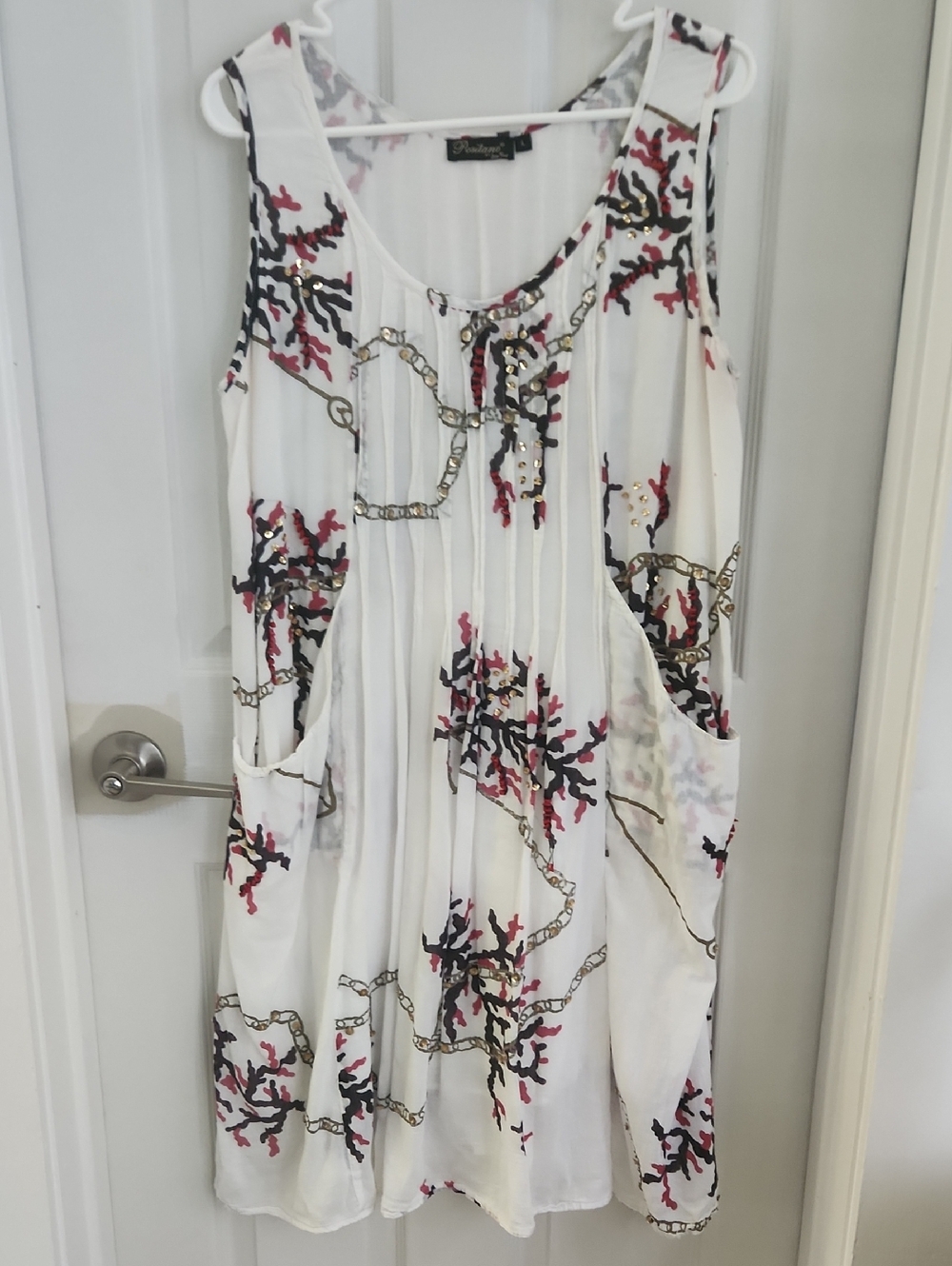 Pleated White Sleeveless Dress with Coral & Chain Print